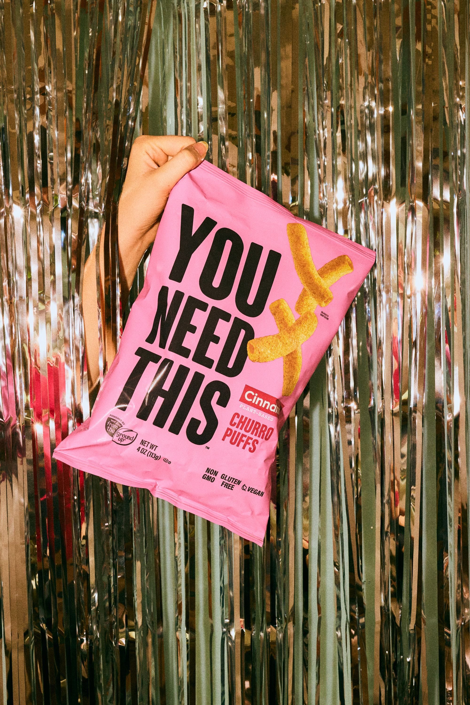 Hand holding You Need This bag